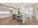 Open concept kitchen with island and breakfast bar at 2640 Joseph Dr, Cumming, GA 30028
