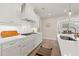 Kitchen with white cabinets, gas range and white subway tile at 2640 Joseph Dr, Cumming, GA 30028