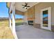 Covered patio with brick fireplace and ceiling fan at 2640 Joseph Dr, Cumming, GA 30028