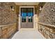 Elegant entryway with double doors and stone accents at 2640 Joseph Dr, Cumming, GA 30028