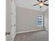 Spacious bedroom with carpeted floor and ceiling fan at 11075 Ellsworth Cv, Suwanee, GA 30024