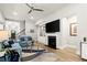 Spacious living room featuring a fireplace, built-in shelving, and hardwood floors at 809 Kirby Dr, Woodstock, GA 30188