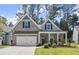 Two-story house with brick and siding exterior, two-car garage, and landscaping at 809 Kirby Dr, Woodstock, GA 30188