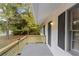 Inviting front porch with modern wood railing at 200 Sunrise Cir, Riverdale, GA 30274