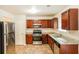 Kitchen with granite countertops and dark wood cabinets at 6257 Selborn Sw Dr, Atlanta, GA 30331