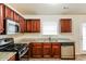 Well-equipped kitchen featuring granite countertops and stainless steel appliances at 6257 Selborn Sw Dr, Atlanta, GA 30331