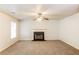 Spacious living room featuring a fireplace and carpeted floors at 6257 Selborn Sw Dr, Atlanta, GA 30331