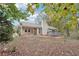 Rear view of charming ranch home with grey siding and deck at 2645 Sims Crest Ct, Snellville, GA 30078