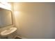 Simple bathroom with pedestal sink, mirror, and bathtub at 1560 Iris Walk, Jonesboro, GA 30238