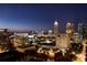 Night view of Midtown Atlanta skyline, featuring illuminated skyscrapers and city lights at 235 The Prado, Atlanta, GA 30309