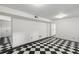 Finished basement with black and white checkered floors and multiple rooms at 235 The Prado, Atlanta, GA 30309