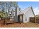 Gray siding home with wooden deck and fenced backyard at 949 Heartwood Cir, Lawrenceville, GA 30043