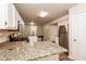 Kitchen boasts granite countertops and stainless steel appliances at 949 Heartwood Cir, Lawrenceville, GA 30043