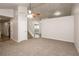 Spacious living room with neutral carpeting and a ceiling fan at 949 Heartwood Cir, Lawrenceville, GA 30043