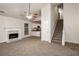 Living room with vaulted ceilings, fireplace, and neutral carpeting at 949 Heartwood Cir, Lawrenceville, GA 30043