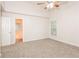 Main bedroom with private bathroom access and ceiling fan at 949 Heartwood Cir, Lawrenceville, GA 30043