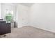 Bright office space with a large window and carpeted floor at 4429 Newfangle Rd, Stone Mountain, GA 30083