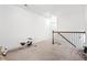 Spacious loft area with carpeted floor and a view of the staircase at 4429 Newfangle Rd, Stone Mountain, GA 30083