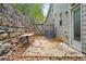 Private patio with stone wall and gate at 4429 Newfangle Rd, Stone Mountain, GA 30083