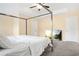 Main bedroom with a large bed, carpet flooring, and two doors at 4429 Newfangle Rd, Stone Mountain, GA 30083