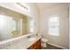 Clean bathroom with granite vanity and a bathtub at 4112 Meadowlark Ct, Powder Springs, GA 30127