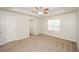 Spacious bedroom with neutral carpeting and ceiling fan at 4112 Meadowlark Ct, Powder Springs, GA 30127