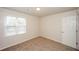 Bright bedroom with neutral walls, carpet and window with blinds at 4112 Meadowlark Ct, Powder Springs, GA 30127