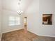 Dining area with tile flooring and chandelier at 4112 Meadowlark Ct, Powder Springs, GA 30127
