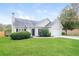 House exterior with a green lawn and shrubs at 4112 Meadowlark Ct, Powder Springs, GA 30127