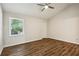 Spacious bedroom with vaulted ceiling, wood-look flooring, and large window at 4052 Elm St, Atlanta, GA 30341