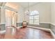 Spacious dining room featuring hardwood floors and a charming chandelier at 408 Gray Fox Dr, Canton, GA 30114