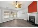 Living room with fireplace, wood-look floors, and a ceiling fan at 259 Diamond Valley Pass, Canton, GA 30114