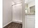 Bathroom with shower, granite countertop, and white cabinets at 1525 Burberry Alley, Marietta, GA 30008