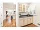 Built-in wet bar with granite countertop and glass-front cabinets at 1195 Old Woodbine Rd, Atlanta, GA 30319