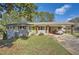 Ranch home with carport and landscaped yard at 2376 Falls River Dr, Lithia Springs, GA 30122