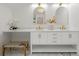 Double vanity with white cabinets, gold hardware, and marble countertop at 116 3Rd Ave, Decatur, GA 30030