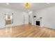 Light and airy bedroom featuring hardwood floors and a fireplace at 116 3Rd Ave, Decatur, GA 30030