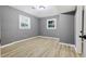 Spacious bedroom with gray walls and light wood-look flooring at 1025 Buckhurst Dr, College Park, GA 30349