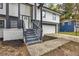 Front entrance with gray steps and modern railing at 1025 Buckhurst Dr, College Park, GA 30349