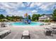 Community pool with water features and plenty of lounge chairs at 197 Stafford Ln, Villa Rica, GA 30180