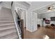 Modern staircase with dark wood railing leading to the upper level at 197 Stafford Ln, Villa Rica, GA 30180