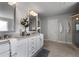 Spa-like bathroom with double vanity, granite countertop, and a walk-in shower at 197 Stafford Ln, Villa Rica, GA 30180