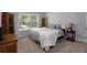 Comfortable bedroom with a queen-size bed and wood furniture at 197 Stafford Ln, Villa Rica, GA 30180