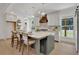 Modern kitchen with a large island and white cabinets at 995 Whitehead Rd, Sugar Hill, GA 30518