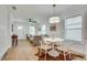 Modern dining area with white table and chairs, hardwood floors at 1078 Hobson Sw St, Atlanta, GA 30310