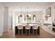 Modern kitchen with white cabinets, island, and pendant lighting at 625 Mayfair Ct, Alpharetta, GA 30009