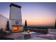 Rooftop terrace with fireplace, seating area, and city views at 625 Mayfair Ct, Alpharetta, GA 30009