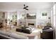 Spacious living room with fireplace, built-in shelving, and comfortable seating at 625 Mayfair Ct, Alpharetta, GA 30009