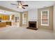 Open living room with fireplace and view into kitchen at 3612 Bancroft Main Nw, Kennesaw, GA 30144