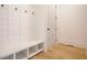 Mudroom with built-in bench and storage at 64 Maple St, Roswell, GA 30075